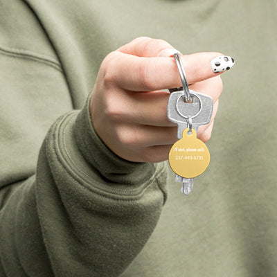 Lady holding a pink poster custom pet tag gold